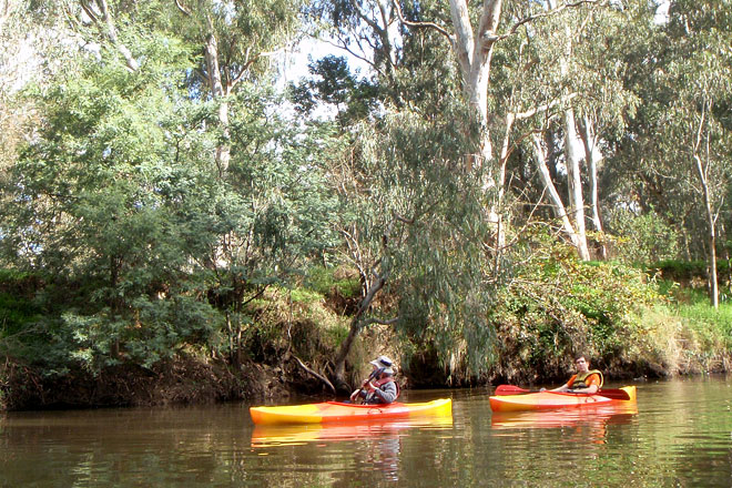 Two mates on one-person kayaks