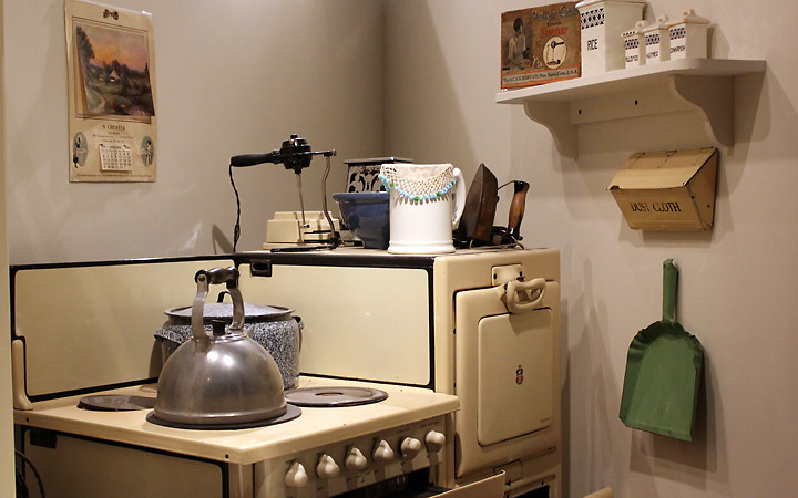 stovetop with kettle, dustpan, etc.